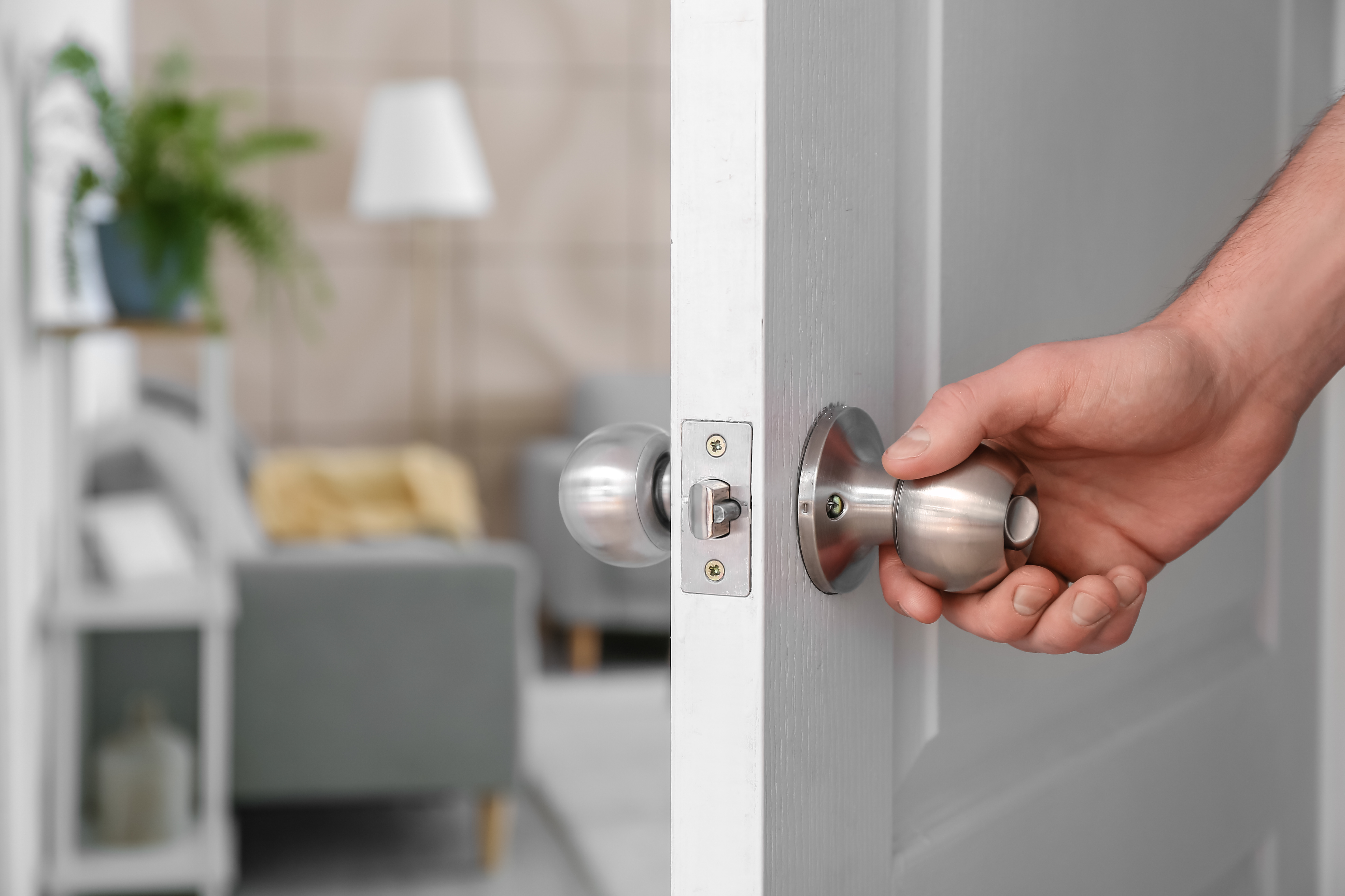 Opening a door.